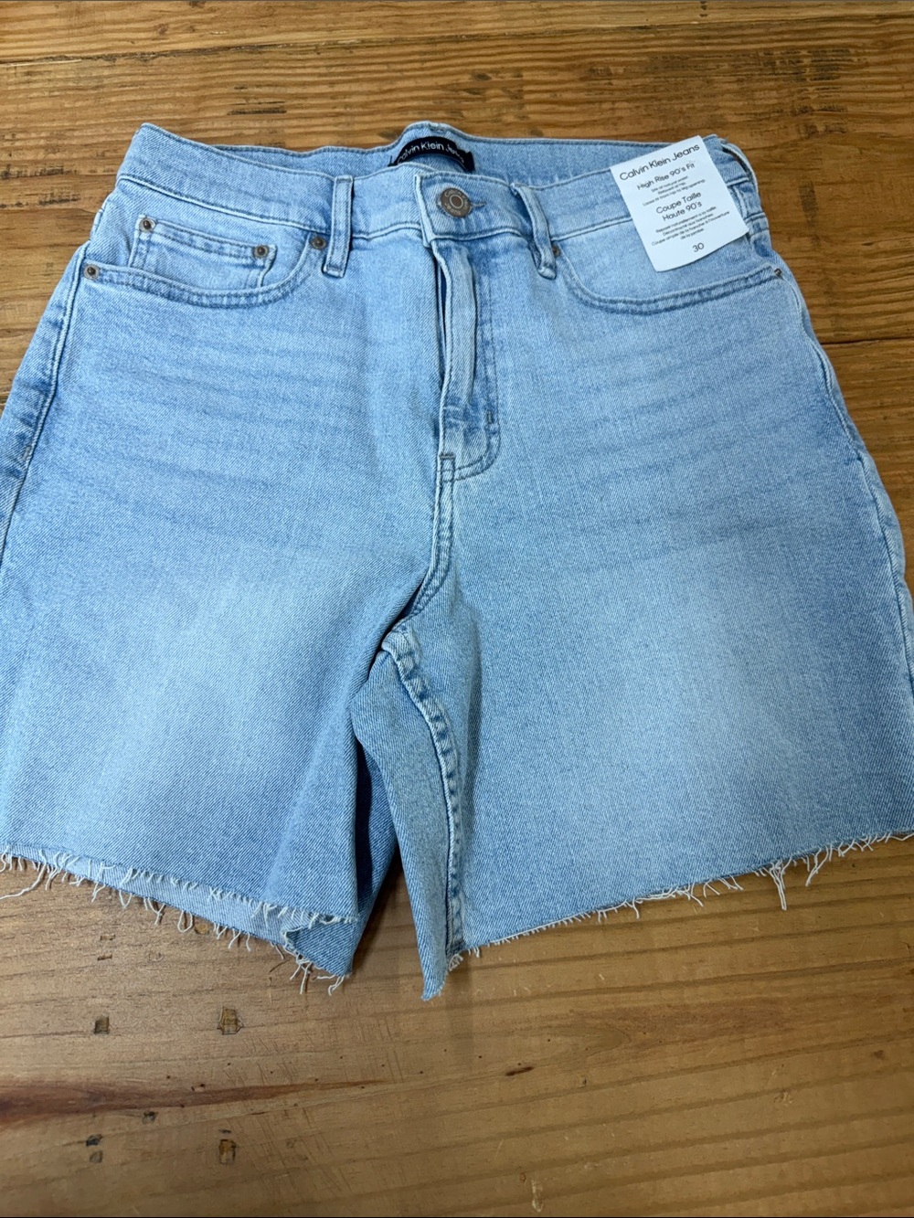 Calvin Klein Light Wash Raw Hem Denim Shorts